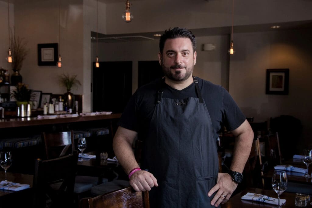Chef Gio Osso standing inside Virtù Honest Craft in Scottsdale.