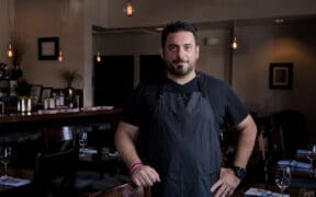 Chef Gio Osso standing inside Virtù Honest Craft in Scottsdale.