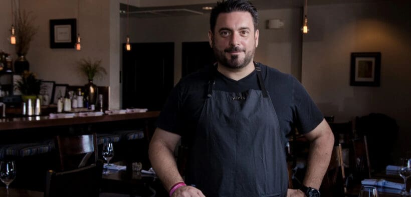 Chef Gio Osso standing inside Virtù Honest Craft in Scottsdale.