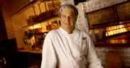Chef Kim Canteenwalla stands inside a restaurant kitchen in Las Vegas.