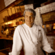 Chef Kim Canteenwalla stands inside a restaurant kitchen in Las Vegas.