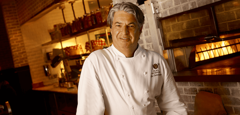 Chef Kim Canteenwalla stands inside a restaurant kitchen in Las Vegas.