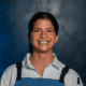 Chef Rema Maaliki wearing a blue apron at BearLeek in Denver.