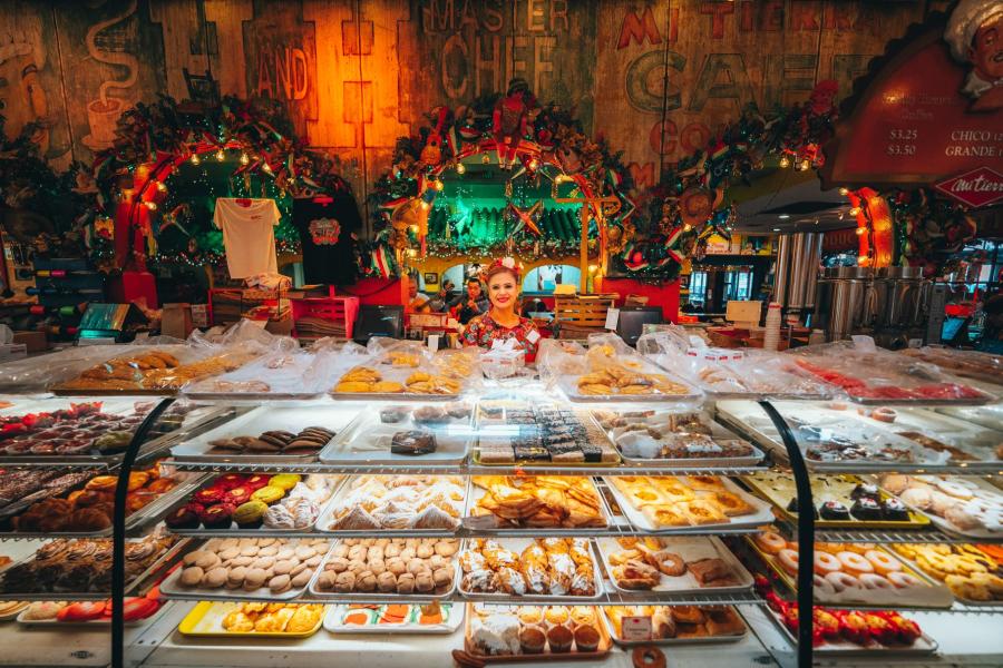 Bakery counter filled with Mexican pastries and sweet breads inside Mi Tierra Café y Panadería in San Antonio.