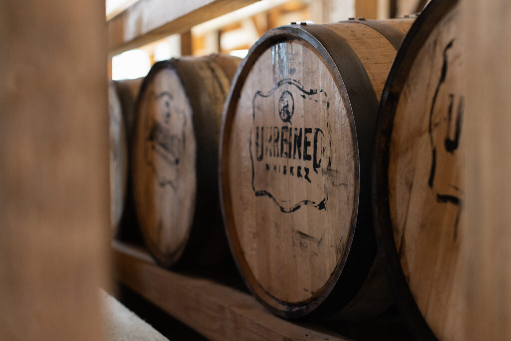 Unreined Whiskey barrels aging inside the rickhouse at WildHorse Ranch in College Station, Texas.