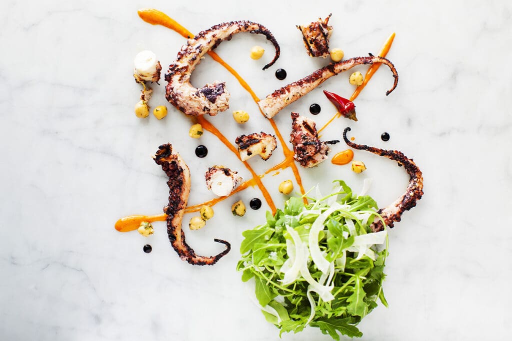 Charred octopus with lemon ceci, arugula and fennel at Virtù Honest Craft.